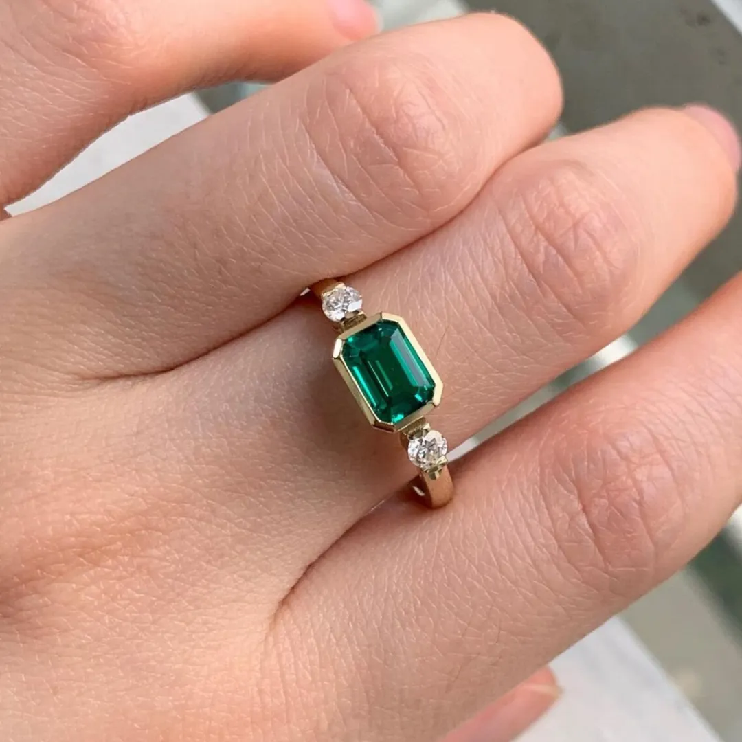 /public/photos/live/Green Emerald Moissanite 3 Stone Engagement Ring 472 (1).webp